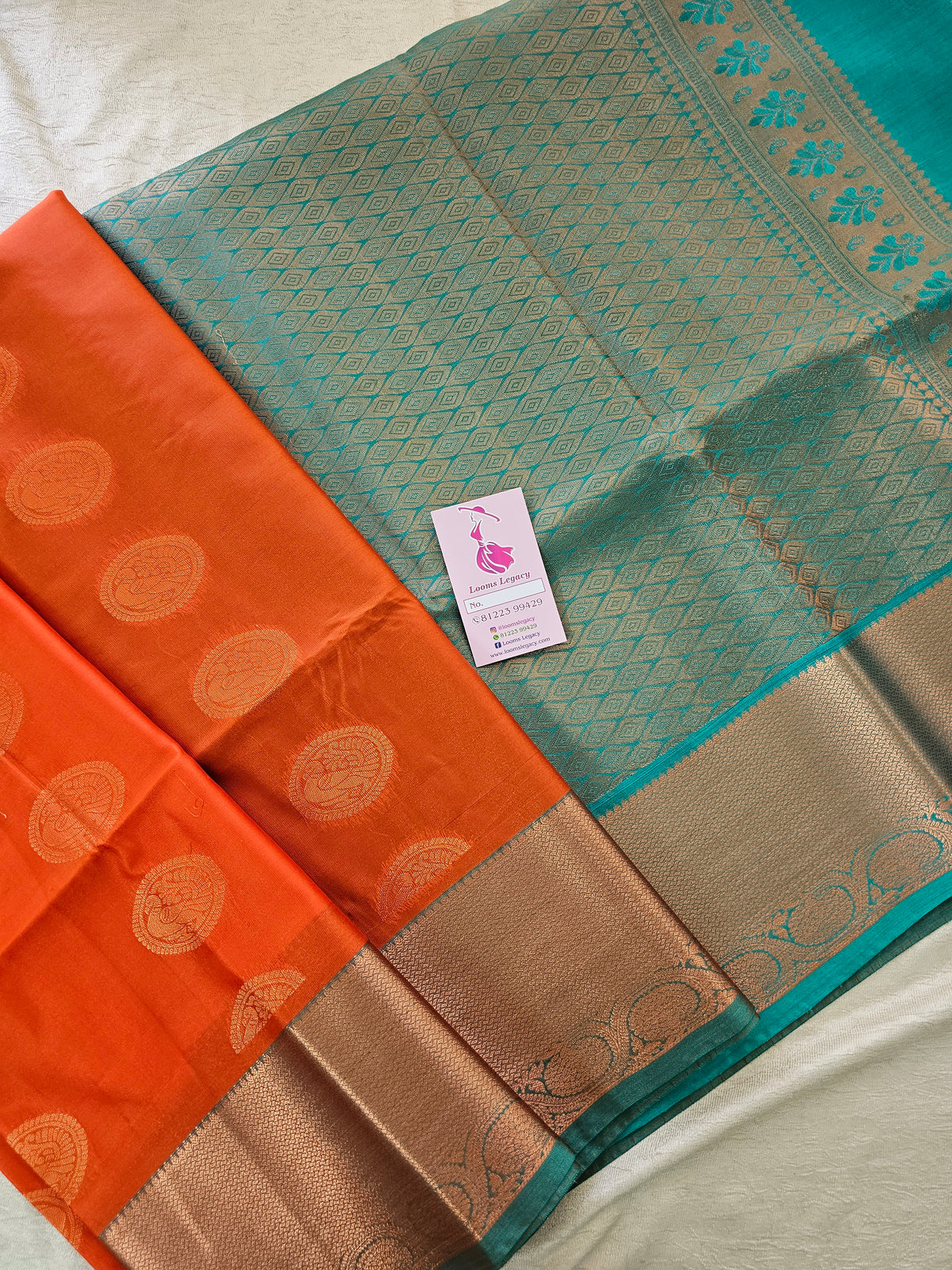 Orange with Sea Green Copper Zari Woven Border Semi Soft Silk Saree