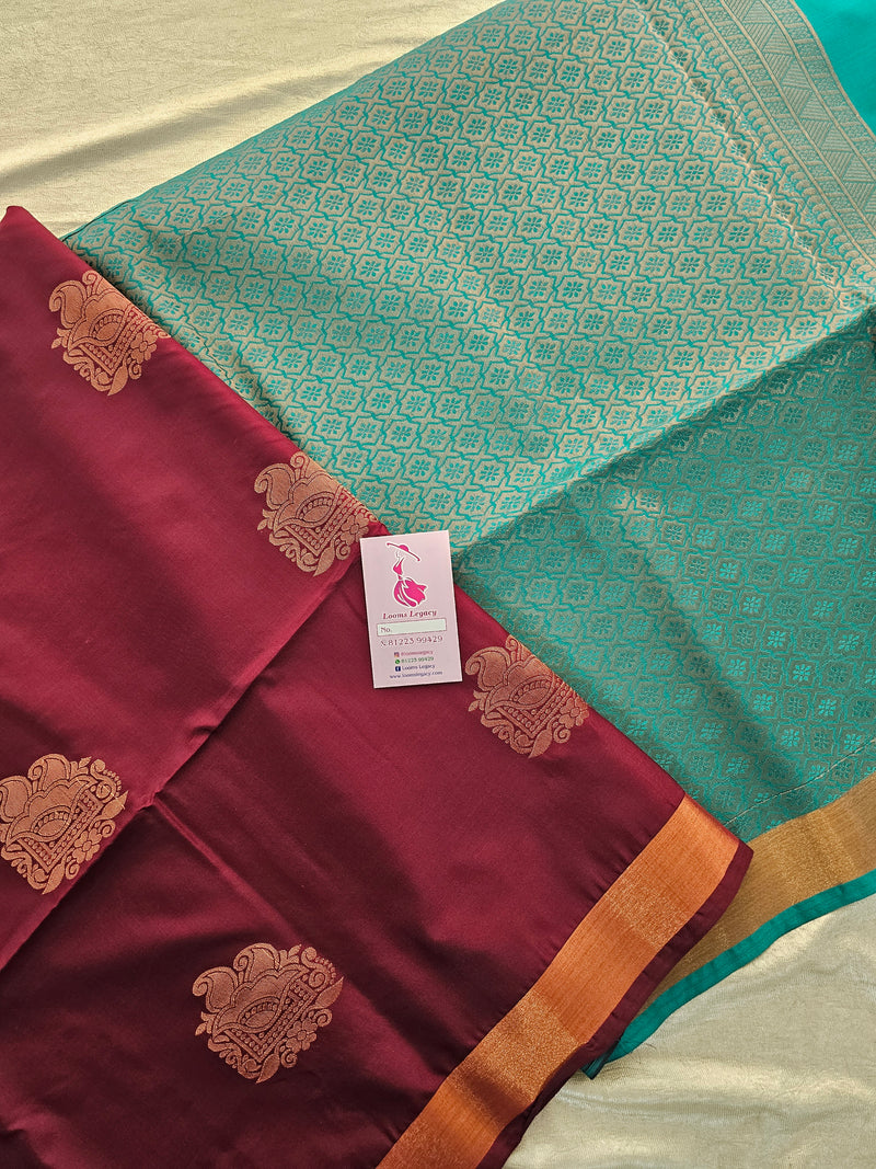 Maroon with Sea Green Copper Zari Woven Border Semi Soft Silk Saree