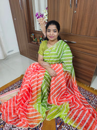 Organza Saree with Zig-Zag Half and Half Pattern and Cut Emboridery Work - Green with Orange