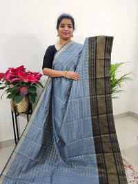 𝐏𝐫𝐞𝐛𝐨𝐨𝐤𝐢𝐧𝐠 𝐨𝐧𝐥𝐲, 𝐃𝐢𝐬𝐩𝐚𝐭𝐜𝐡 𝐓𝐢𝐦𝐞 - 𝟐𝟓 𝐝𝐚𝐲𝐬  Semi Raw Silk Saree - Grey with Black