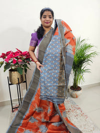 Orange with Grey Tussar Silk Saree with Zari Border