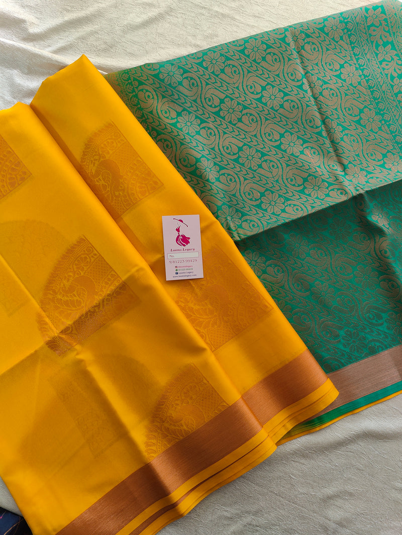 Yellow with Sea Green Copper Zari Woven Border Semi Soft Silk Saree