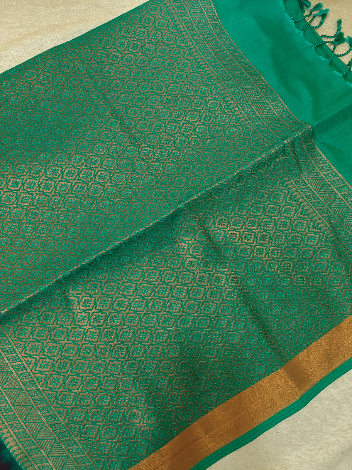 Brown with Sea Green Copper Zari Woven Border Semi Soft Silk Saree