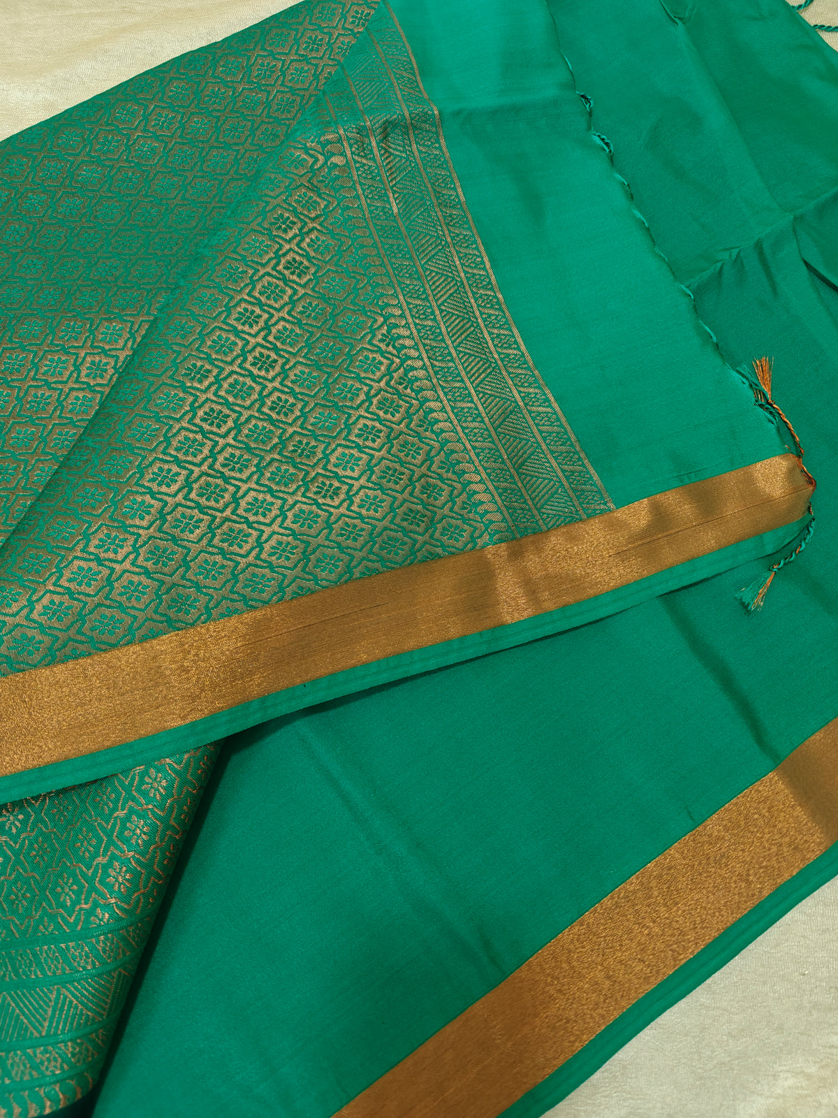 Brown with Sea Green Copper Zari Woven Border Semi Soft Silk Saree