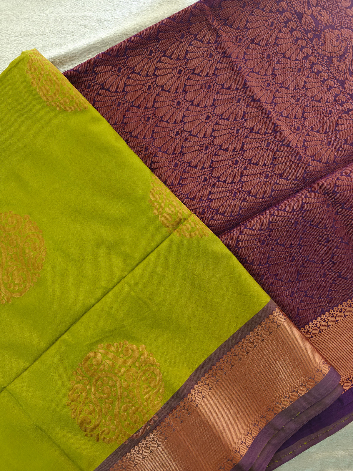 Green with Purple Copper Zari Woven Border Semi Soft Silk Saree