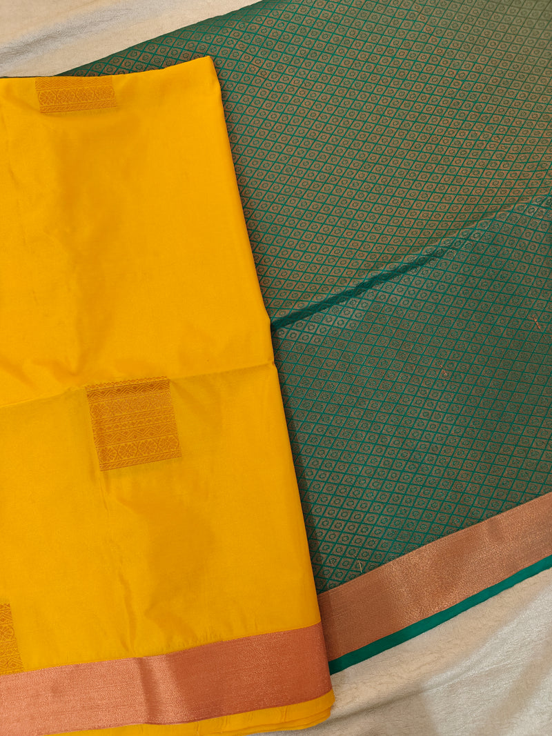 Yellow with Sea Green Copper Zari Woven Border Semi Soft Silk Saree