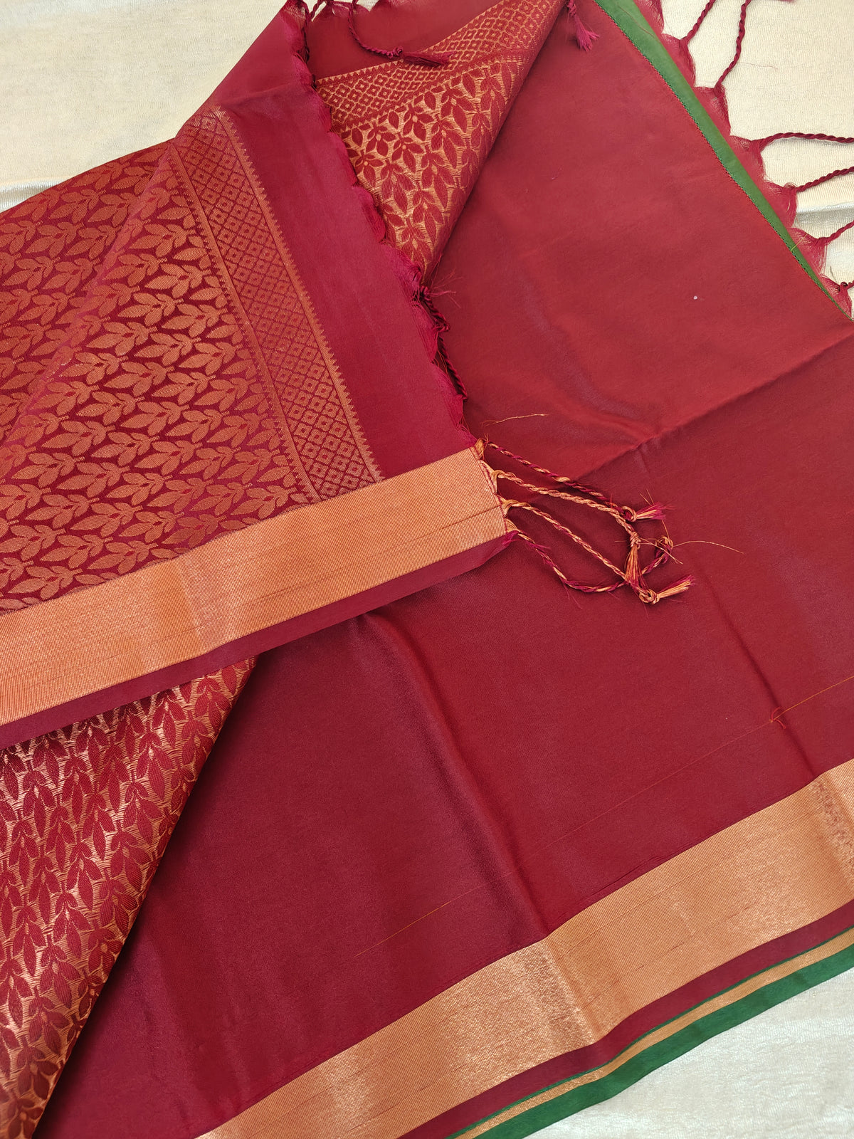 Green with Maroon Copper Zari Woven Border Semi Soft Silk Saree